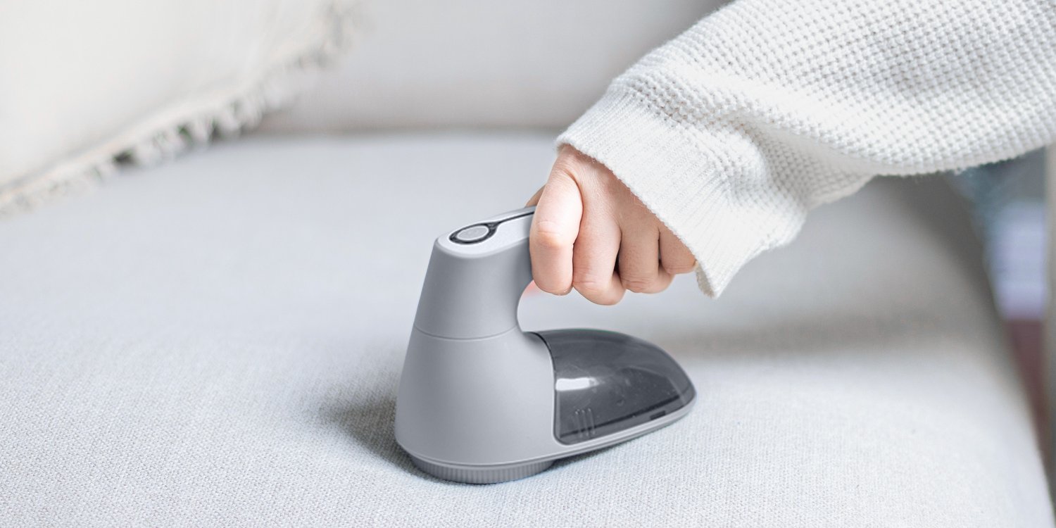 Using a Bymore fabric shaver on sofa upholstery